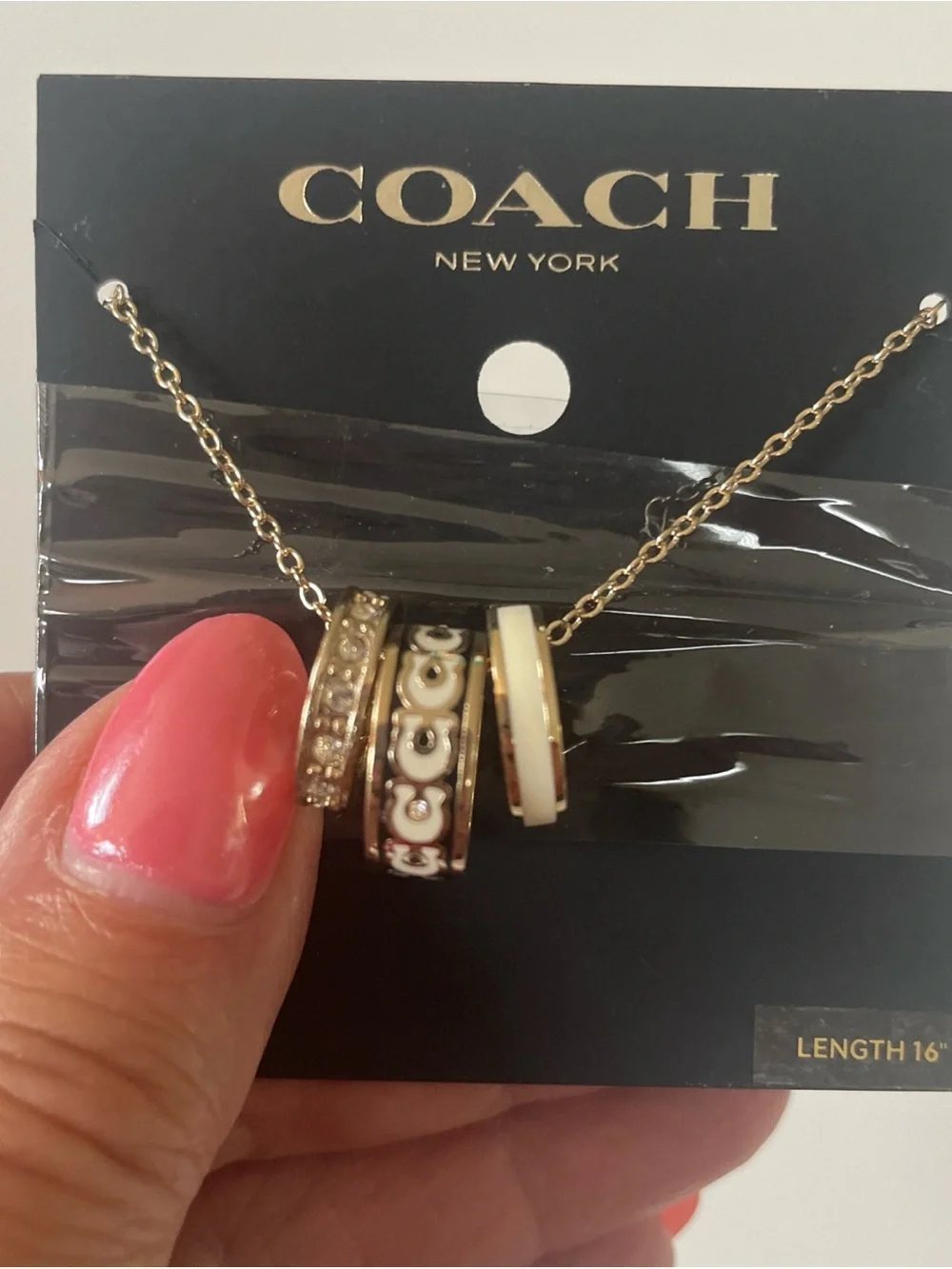 Coach Gold-Tone Necklace with White Enamel and Crystal-Accented Rings